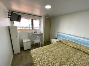En eller flere senger på et rom på Hostal del Viajero