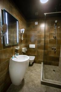 Koupelna v ubytování Apart Hotel West
