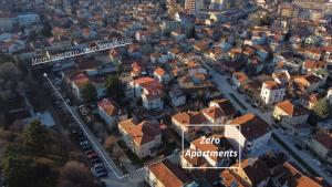 an overhead view of a city with buildings and cars at ZARO Apartments in Bitola