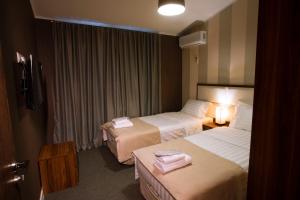 Postel nebo postele na pokoji v ubytování Apart Hotel West