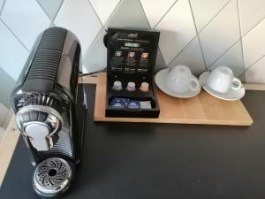 a black blender sitting on a counter next to two dishes at Bruderherz in Nuremberg