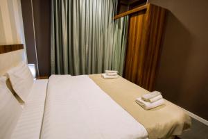 Postel nebo postele na pokoji v ubytování Apart Hotel West