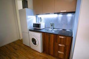 Kuchyň nebo kuchyňský kout v ubytování Apart Hotel West