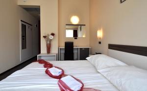 Postel nebo postele na pokoji v ubytování Hotel Fontana