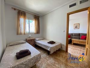 Postel nebo postele na pokoji v ubytování La Ciñuelica R11 Ground Floor Apartment Com Pool L111