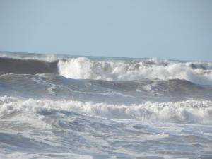 a large group of waves in the ocean at Hotel Les Pins in Hourtin