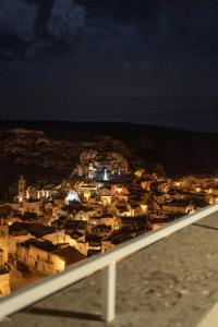 a view of a city at night at Albergo Italia in Matera