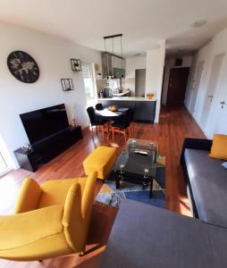 a living room with a couch and a table at Apartman EVA ZAGREB in Zagreb