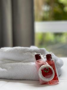 a close up of a bottle of soap and a towel at Village Boipeba in Cayru