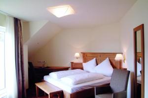 Postel nebo postele na pokoji v ubytování Hotel Jägerhof