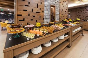 a buffet line with many different types of food at Gorski Hotel & Spa in Kopaonik