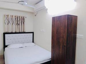 Ένα ή περισσότερα κρεβάτια σε δωμάτιο στο Hotel Seven Star