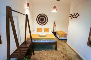 Postel nebo postele na pokoji v ubytování Mandala Hostel Jeri