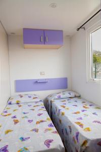 Llit o llits en una habitació de Camping Delfino