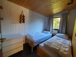 Postel nebo postele na pokoji v ubytování Ferienhaus am Südhang der Bentheimer Berge nah an der Natur