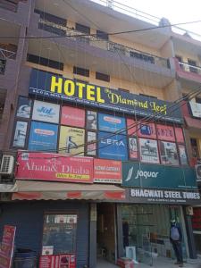 a hotel sign on the side of a building at HOTEL THE DIAMOND LEAF in Chandīgarh