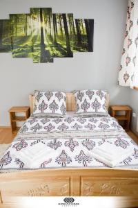 Ένα ή περισσότερα κρεβάτια σε δωμάτιο στο Słoneczny Domek