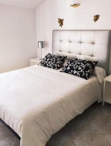 A bed or beds in a room at Casa Peto Outes