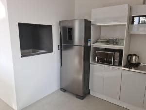 Imagen de la galería de Apartamento no Shopping Vesta, com piscina!, en Torres