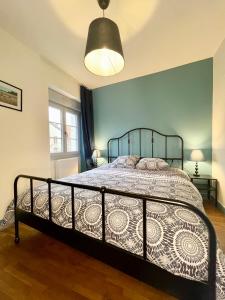 a bedroom with a bed in a room with a window at Le gîte de l’espérance in Arc-en-Barrois