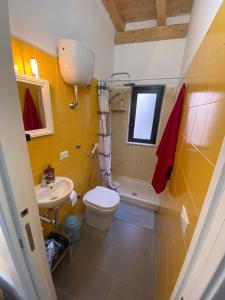 a bathroom with a toilet and a sink at B&B Casetta Verde FELICE in Scilla +28 photos