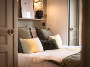 a bedroom with a bed and a mirror at Hôtel Restaurant La Ferme de Cupelin in Saint-Gervais-les-Bains