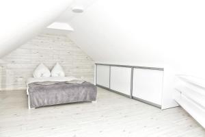 Posteľ alebo postele v izbe v ubytovaní Apartament w Chmurach - Apartamentuj