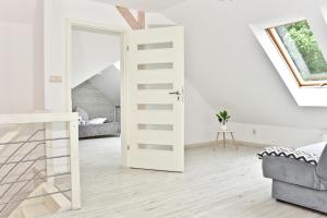 Posteľ alebo postele v izbe v ubytovaní Apartament w Chmurach - Apartamentuj