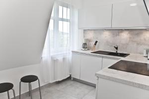 Kuchyňa alebo kuchynka v ubytovaní Apartament w Chmurach - Apartamentuj