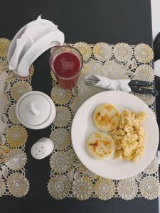 a table with a plate of food on a table at HOTEL IMPERIAL in Maicao