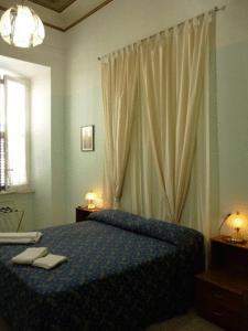 Postel nebo postele na pokoji v ubytování Hotel Ferraro