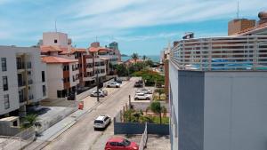 a view of a city street with cars on the road at Residencial Marina’s in Florianópolis