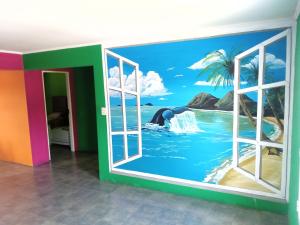 a room with a window view of the ocean at El Paraná in Ramallo