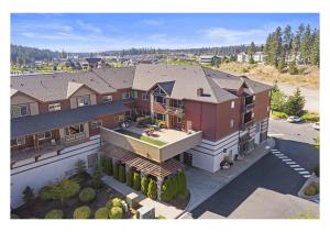 an aerial view of a large house at Modern Riverstone Condo with Grand Deck - Steps to Shops, Restaurants & Trail in Coeur d'Alene