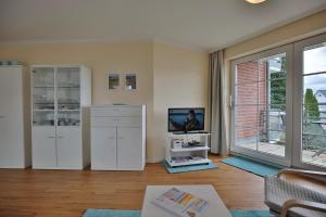 TV a/nebo společenská místnost v ubytování Gorch-Fock-Park Haus 02 Gorch-Fock-Park 2 Appartement 15