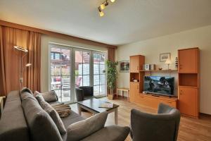 TV a/nebo společenská místnost v ubytování Gorch-Fock-Park Haus 06 Gorch-Fock-Park 6 Appartement 4