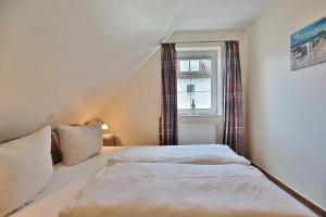 Ένα ή περισσότερα κρεβάτια σε δωμάτιο στο Sunshine-Residenz Sunshine Residenz Appartement 5