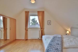 Postel nebo postele na pokoji v ubytování Sunshine-Residenz Sunshine Residenz Appartement 6
