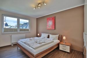 Postel nebo postele na pokoji v ubytování Residenz Herrenbruchstr Residenz Herrenbruchstraße 5 Appartement 4