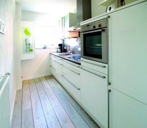Kuchyň nebo kuchyňský kout v ubytování Haus an der Strandallee 112 Haus an der Strandallee 112 Appartement 7