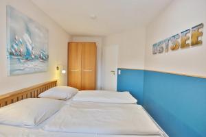 Ένα ή περισσότερα κρεβάτια σε δωμάτιο στο Residenz Ostseestrand Appartement 19 +17 φωτογραφίες