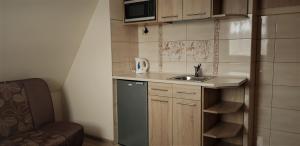 Kuchyňa alebo kuchynka v ubytovaní Pokoje Apartamenty Pod Limbą