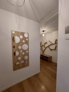 a living room with a painting on the wall at Luxury panorama apartament,Coresi in Braşov