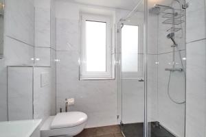 Koupelna v ubytování Residenz am Timmendorfer Platz Residenz am Timmendorfer Platz Appartement 3 + 11 fotografií