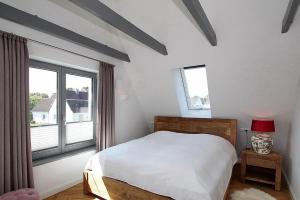 Una cama o camas en una habitación de Ferienhaus Wohrbarg Ferienhaus Wohrbarg