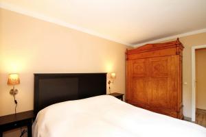 Postel nebo postele na pokoji v ubytování Wohnpark am Mühlenteich Wohnpark am Mühlenteich Appartement 07