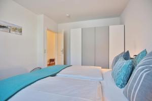 Postel nebo postele na pokoji v ubytování Gorch-Fock-Straße 34 Gorch-Fock-Str 34 Appartement 1
