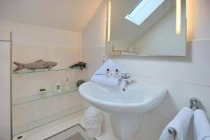 Koupelna v ubytování Doppelhaushälfte Am Knurrhahn Am Knurrhahn Appartement 2 + 21 fotografií