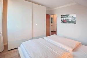 Postel nebo postele na pokoji v ubytování Doppelhaushälfte Am Knurrhahn Am Knurrhahn Appartement 2