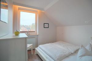 Postel nebo postele na pokoji v ubytování Doppelhaushälfte Am Knurrhahn Am Knurrhahn Appartement 2